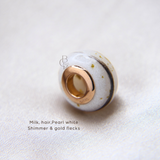 Rose gold bead, milk, hair and gold flecks, pearl white shimmer