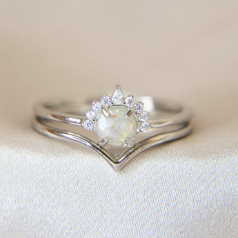 Lightly sprinkled ashes, pearl white shimmer, subtle opalescent flecks
