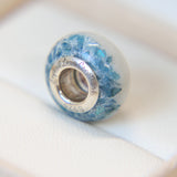Breastmilk bead with pearl white shimmer and blue flecks heavy
