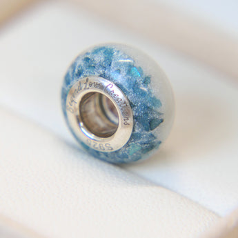 Breastmilk bead with pearl white shimmer and blue flecks heavy