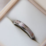 Titanium Cremation band with briar rose flecks and light pink shimmer