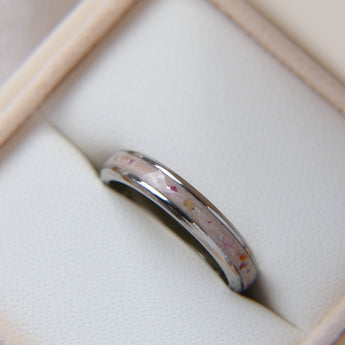 Titanium Cremation band with briar rose flecks and light pink shimmer