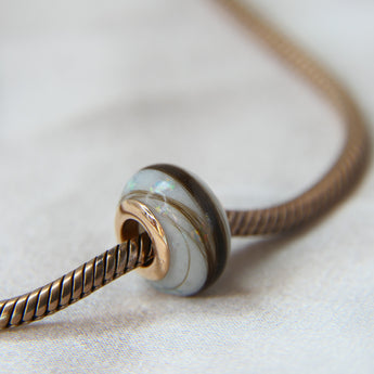 Breastmilk,  pearl white shimmer and white opal, Gold flecks (subtle) and hair bead, rose gold bead