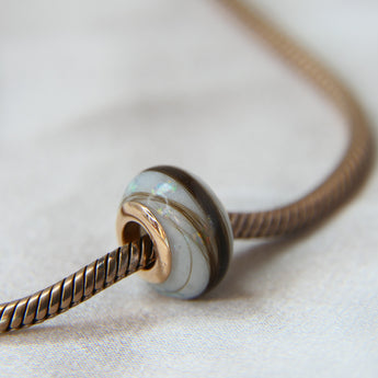 Breastmilk, pearl white shimmer and white opal, Gold flecks (subtle) and hair bead, rose gold bead