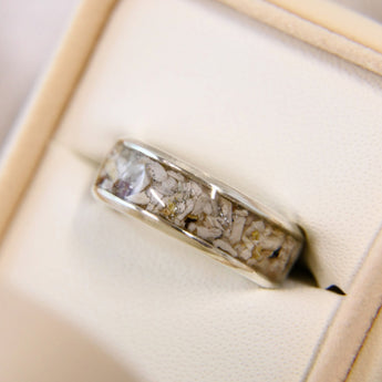sterling silver wide band ring with heavy cremations, no shimmer and a subtle silver glitter