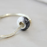 Breastmilk, subtle silver flecks, black and pearl white shimmer