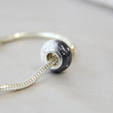Breastmilk, subtle silver flecks, black and pearl white shimmer