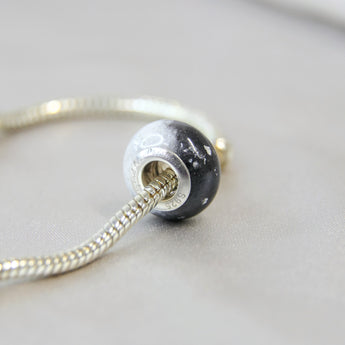 Breastmilk, subtle silver flecks, black and pearl white shimmer
