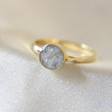 Lightly sprinkled ashes and pearl white shimmer, subtle silver flecks, gold band