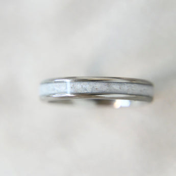 Lightly sprinkled ashes, pearl white shimmer, titanium band