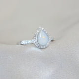 Breastmilk, pearl white shimmer and opalescent flecks