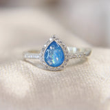 Lightly sprinkled ashes, light blue shimmer, subtle opalescent flecks