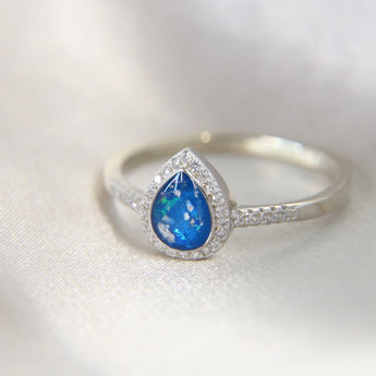 Lightly sprinkled ashes, subtle opalescent fleck, sapphire blue shimmer