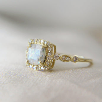 9k yellow gold band, light cremations, opalescent fleck, white opal and subtle pearl shimmer