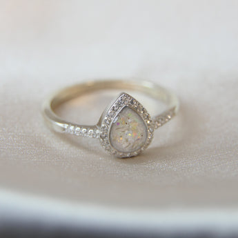 Pearl white shimmer, lightly sprinkled ashes, heavy opalescent flecks, heavy white opal