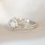 Lightly sprinkled ashes, pearl white shimmer, subtle opalescent flecks