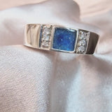 Lightly sprinkled ashes, sapphire blue, silver band