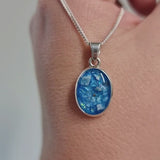 14 x 10 cremation pendant- light blue shimmer, heavy ashes, subtle opalescent flecks