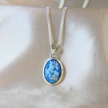 14 x 10 cremation pendant- Light blue shimmer, heavy ashes, subtle opalescent flecks