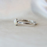 Side view pearl white shimmer, lightly sprinkled ashes, subtle opalescent flecks