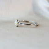 Side view pearl white shimmer, lightly sprinkled ashes, subtle opalescent flecks
