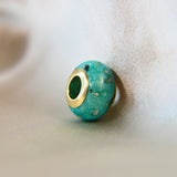 Gold bead teal shimmer, subtle gold flecks, lightly sprinkled ashes