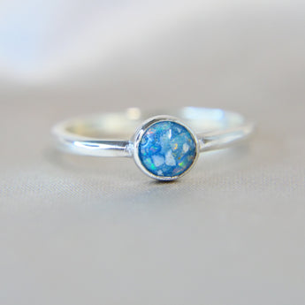 Light blue shimmer, heavy ashes, white crushed opal