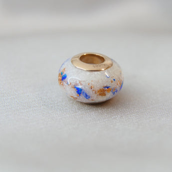 Rose gold bead, breastmilk, no shimmer, heavy rose gold flecks, cobalt blue opal