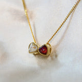 Yellow gold hearts, lightly sprinkled ashes, pearl white shimmer, subtle Opalescent flecks, red shimmer