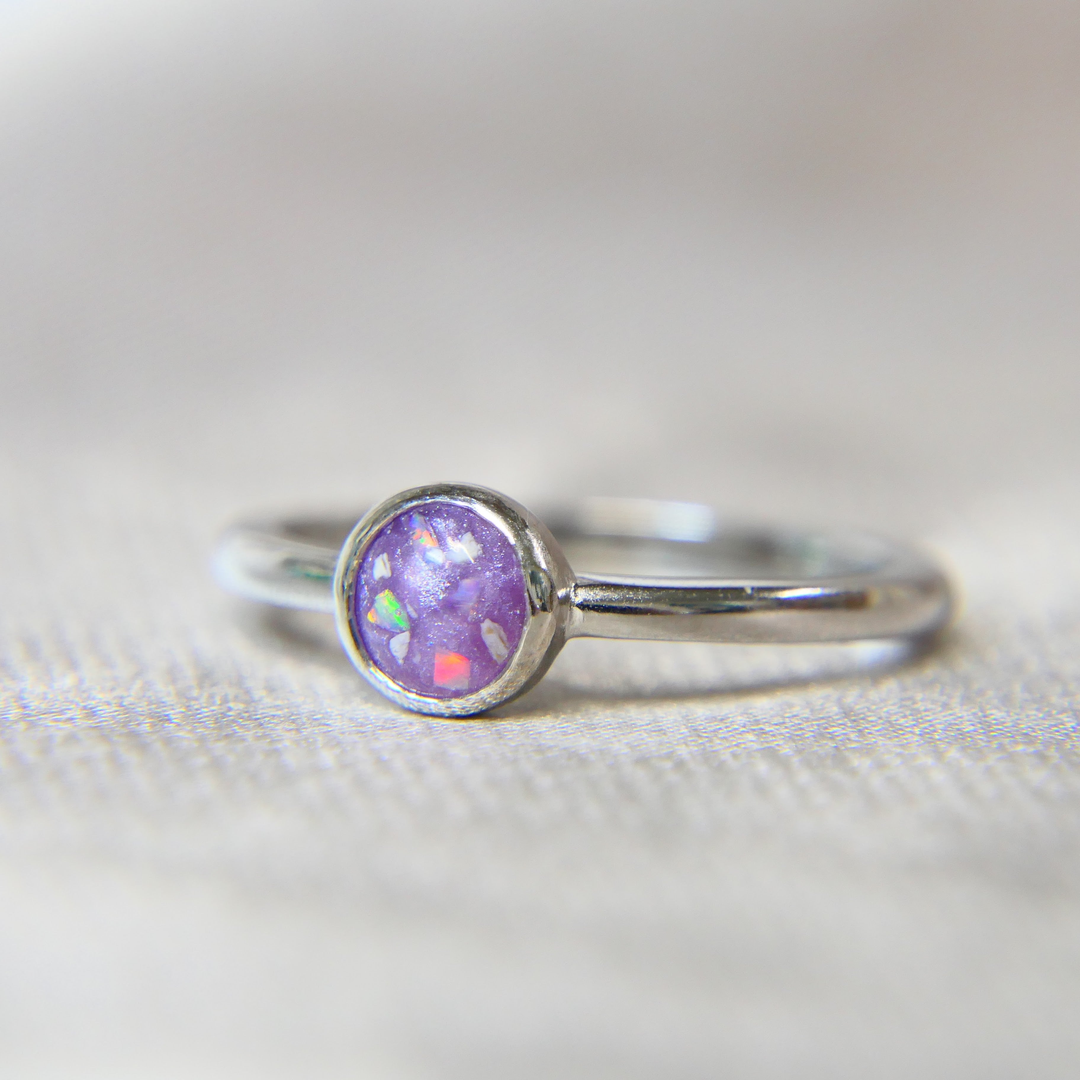 Silver memorial ring, lightly sprinkled ashes, lavendar grey shimmer, white opal