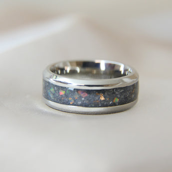 Titanium band, charcoal grey shimmer, subtle rose gold flecks, white opal, heavy ashes