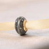 Fur, charcoal grey shimmer, lightly sprinkled ashes, subtle silver flecks, rose gold bead