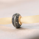 Fur, charcoal grey shimmer, lightly sprinkled ashes, subtle silver flecks, rose gold bead