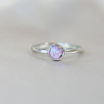 Light pink shimmer, heavy ashes, heavy opalescent