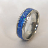 Titanium band, lightly sprinkled ashes, hair, sapphire blue shimmer & cobalt blue crushed opal