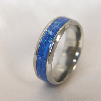 Titanium band, lightly sprinkled ashes, hair, sapphire blue shimmer & cobalt blue crushed opal