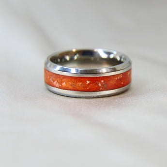 Titanium band, lightly sprinkled ashes, saffron orange shimmer