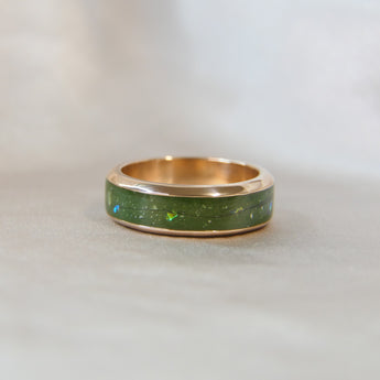 Rose gold band, olive green shimmer, subtle opalescent flecks, lightly sprinkled ashes and hair