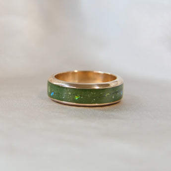 Rose gold band, olive green shimmer, subtle opalescent flecks, lightly sprinkled ashes and hair