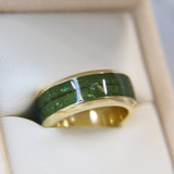 Yellow gold band, olive green shimmer, subtle opalescent flecks, hair, light ashes