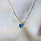 Lightly sprinkled ashes, light blue shimmer, subtle opalescent flecks