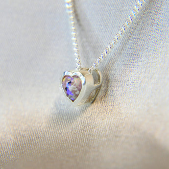 New Version- Light pink shimmer, subtle opalescent flecks, lightly sprinkled ashes, white opal