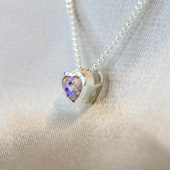 New Version- Light pink shimmer, subtle opalescent flecks, lightly sprinkled ashes, white opal