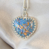 Light blue shimmer, heavy ashes, heavy rose gold flecks, crushed white opal