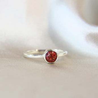 Side view ruby red shimmer, heavy sprinkled ashes