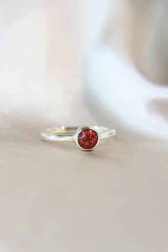 Side view ruby red shimmer, heavy sprinkled ashes