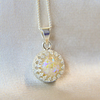 Lightly sprinkled ashes, pearl white shimmer and subtle opalescent flecks