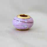 Milk, hair, lavendar grey shimmer, subtle opalescent flecks, gold bead