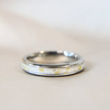Titanium band, breastmilk, pearl white shimmer & heavy gold flecks