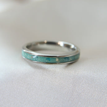 Teal shimmer, subtle blue flecks, lightly sprinkled ashes